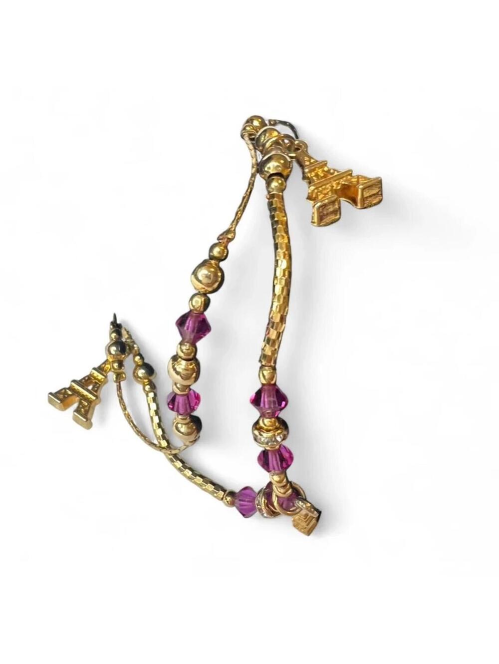 A vintage 22kgp Paris charm bracelet